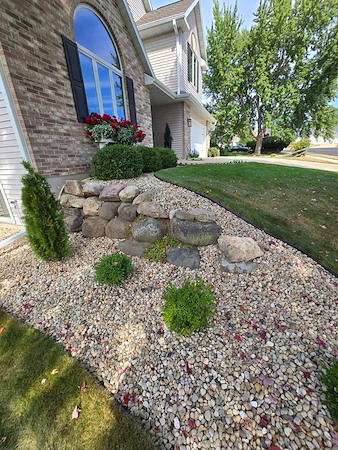 Landscape Rock vs. Mulch: Which Is Better for Wisconsin Weed Control and Drainage?